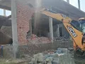 Nuh/Mewat News: अनधिकृत कॉलोनी में अवैध निर्माणों पर चला प्रशासन का पीला पंजा, बिनेश कुमार